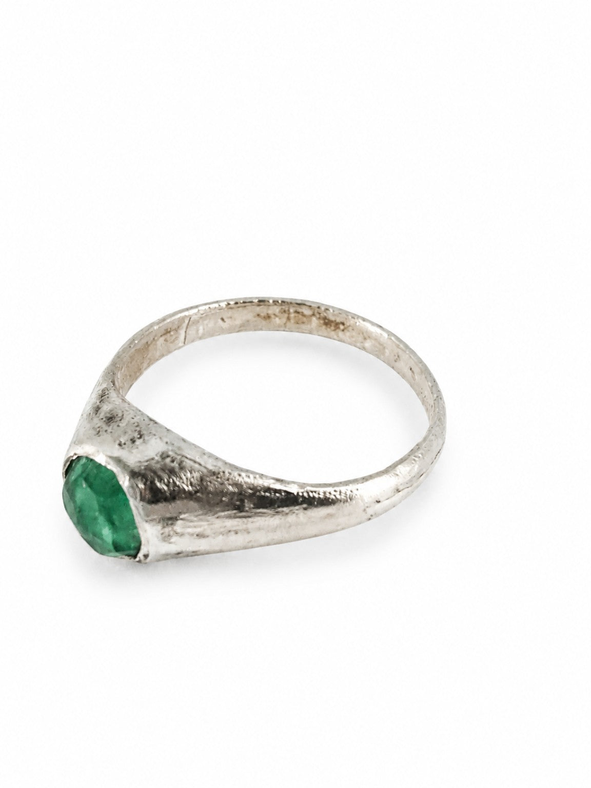 Platinum East Yorkshire medieval emerald stirrup ring showing the raised gemstone setting and handmade surface