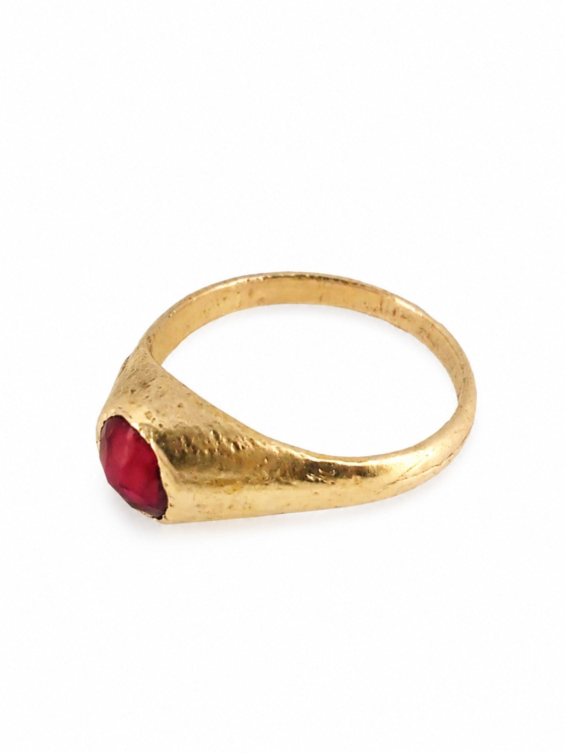 Gold East Yorkshire medieval ruby stirrup ring showing the raised cabochon setting and handmade surface
