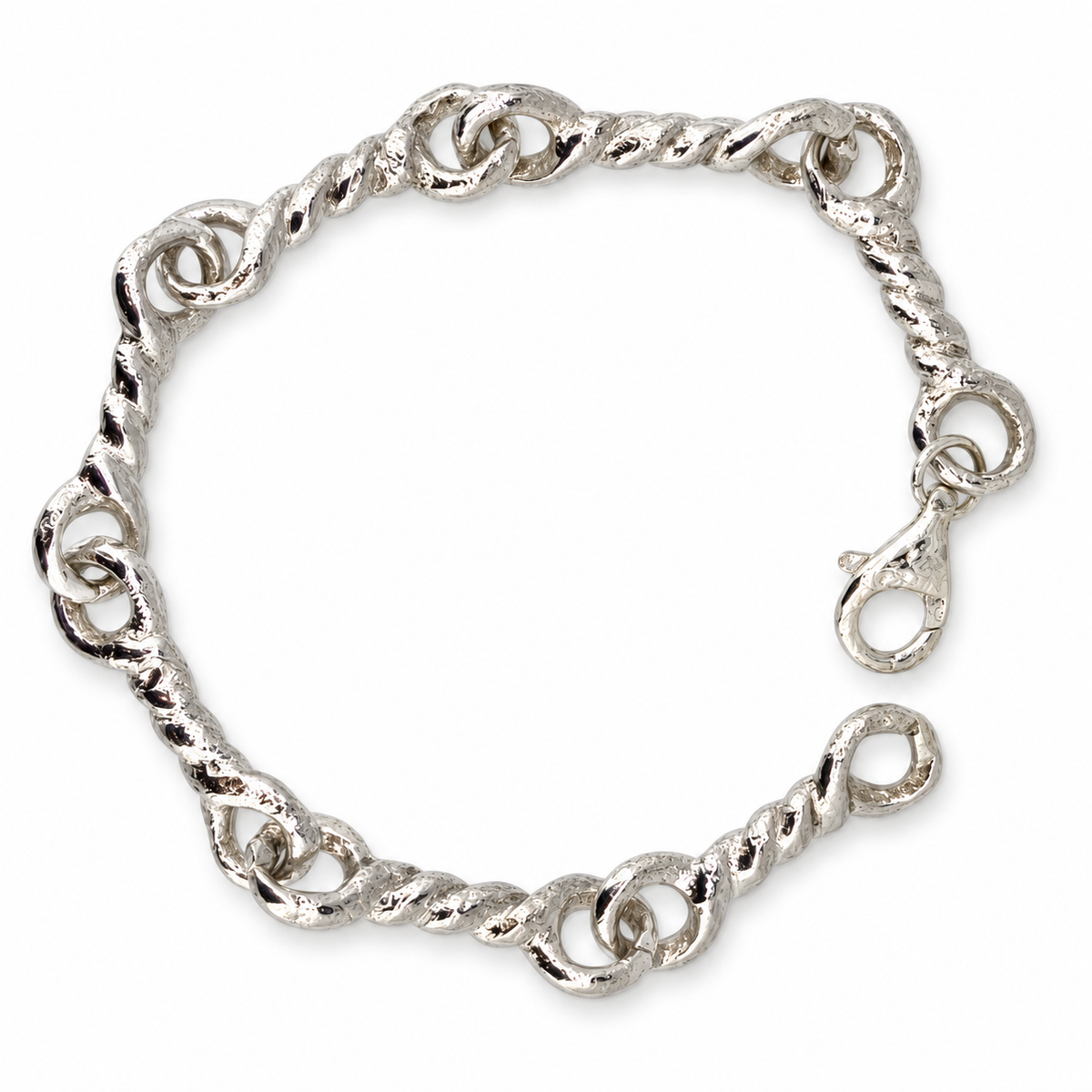 Silver North Yorkshire Early Medieval twisted-link bracelet, overhead view.