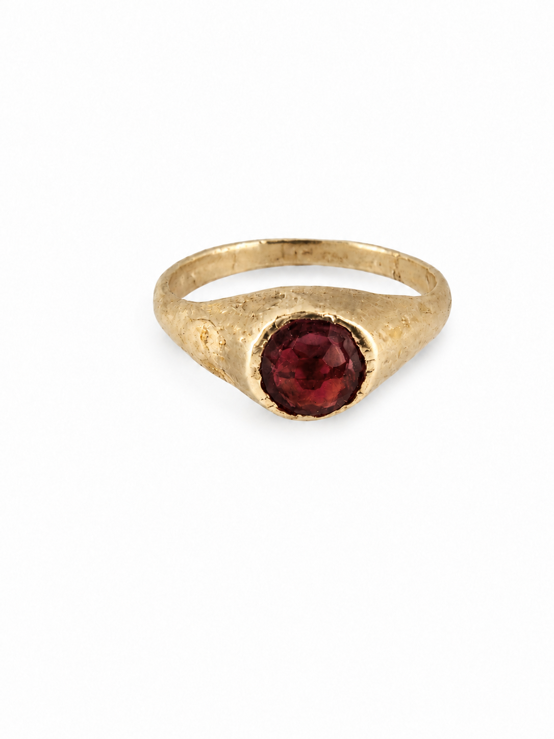 Gold medieval garnet stirrup ring from East Yorkshire, with hand-cut gemstone