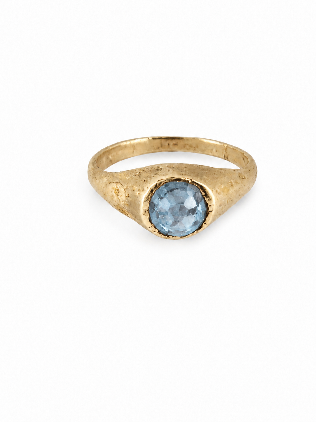Gold medieval pale blue topaz stirrup ring from East Yorkshire, with hand-cut gemstone