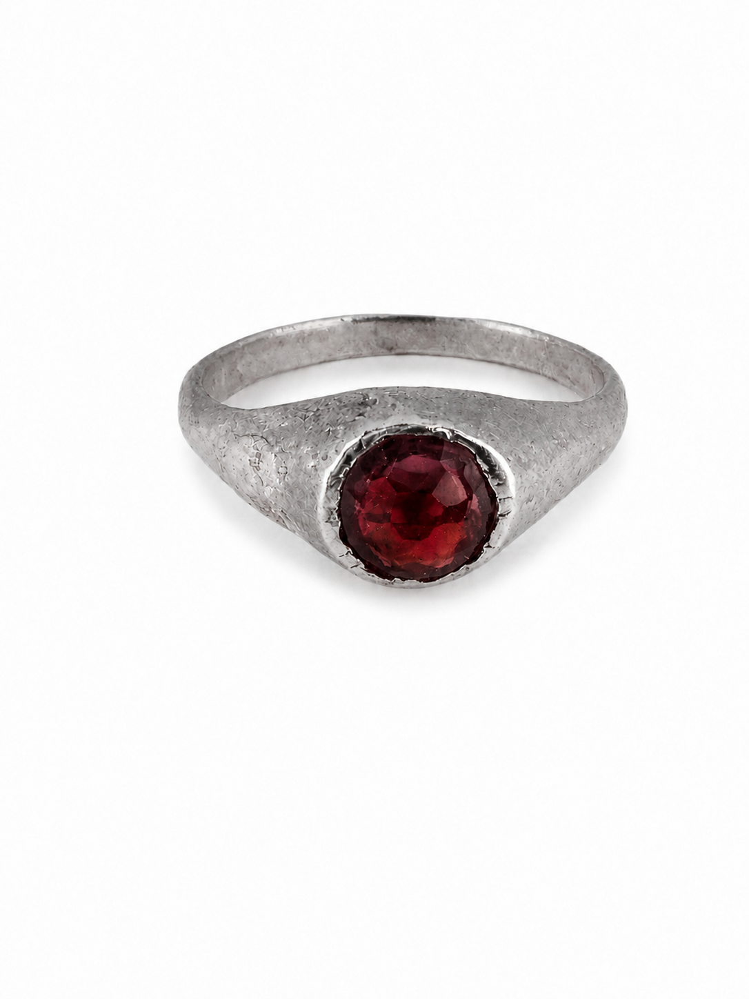 Silver medieval garnet stirrup ring from East Yorkshire, with hand-cut gemstone