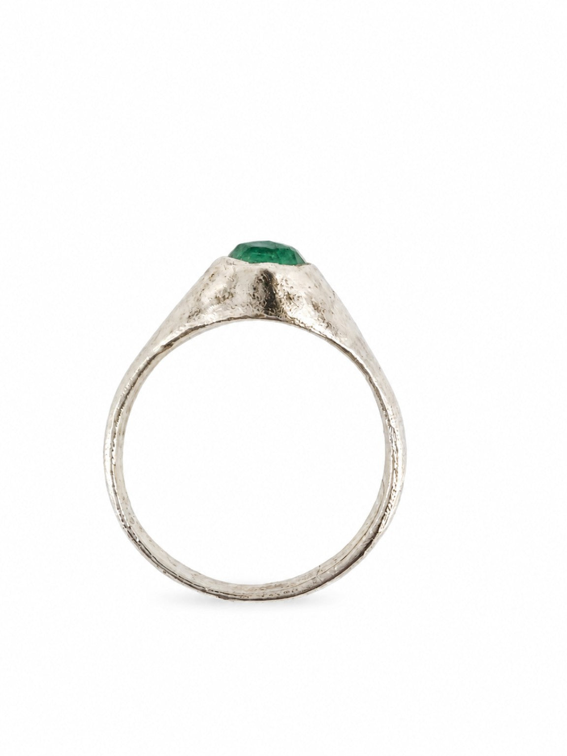 Platinum East Yorkshire medieval emerald stirrup ring showing the elevated cabochon profile and slender band