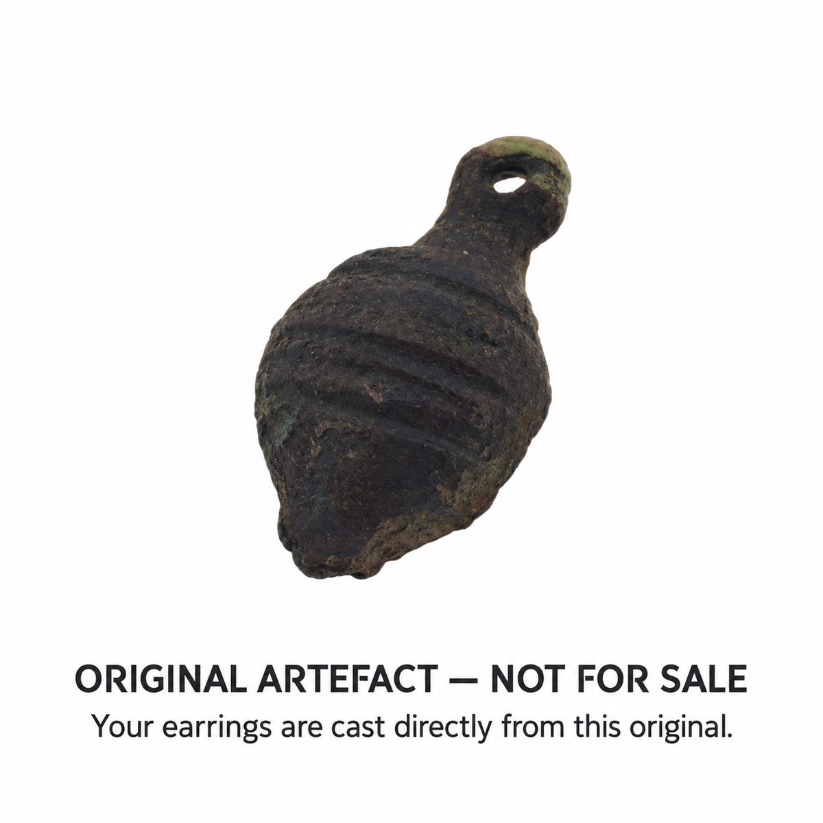Original acorn-shaped artefact found in North Yorkshire, attributed to the Tudor period — not for sale; earring drops are direct castings, angled view