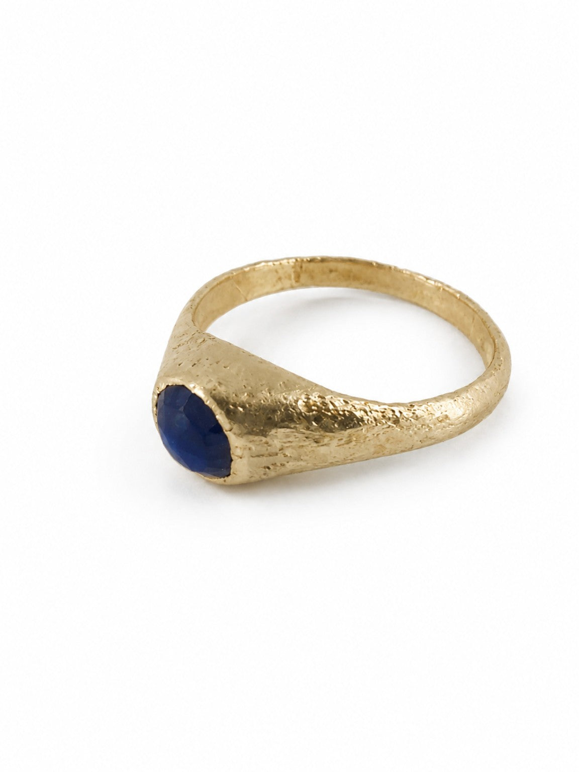 Gold East Yorkshire medieval sapphire stirrup ring showing the raised gemstone setting and handmade surface