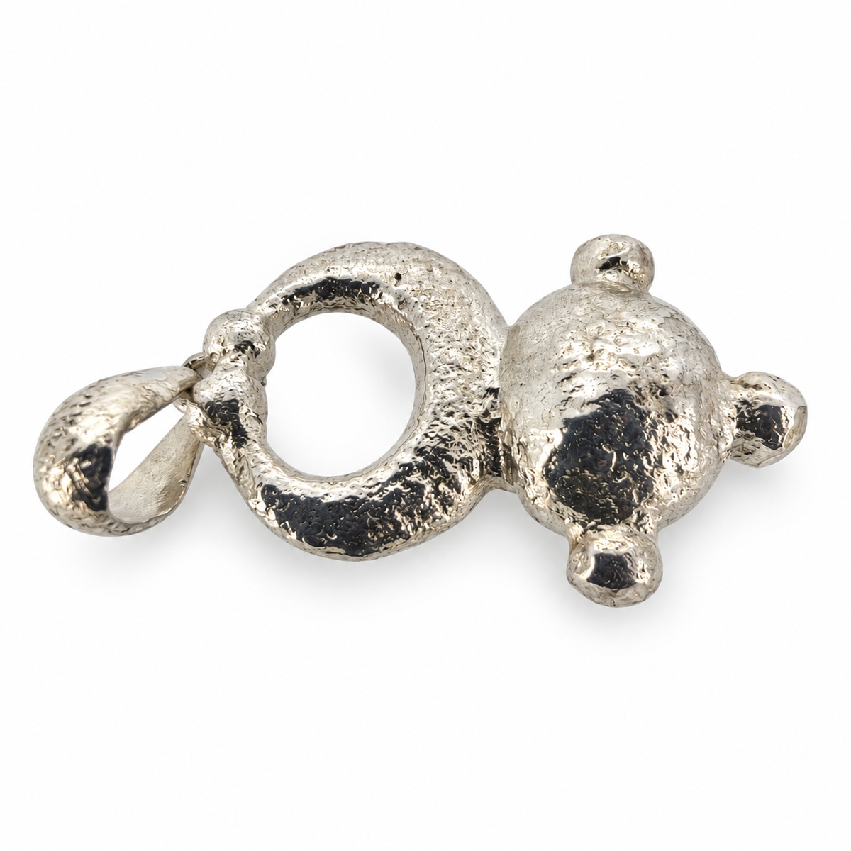 Silver Hampshire pendant viewed from the side, showing its raised dome and cast texture.